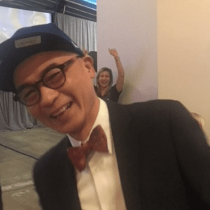 Coleman Fung smiling in formal wear