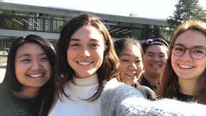 5 young women pose for a selfie.